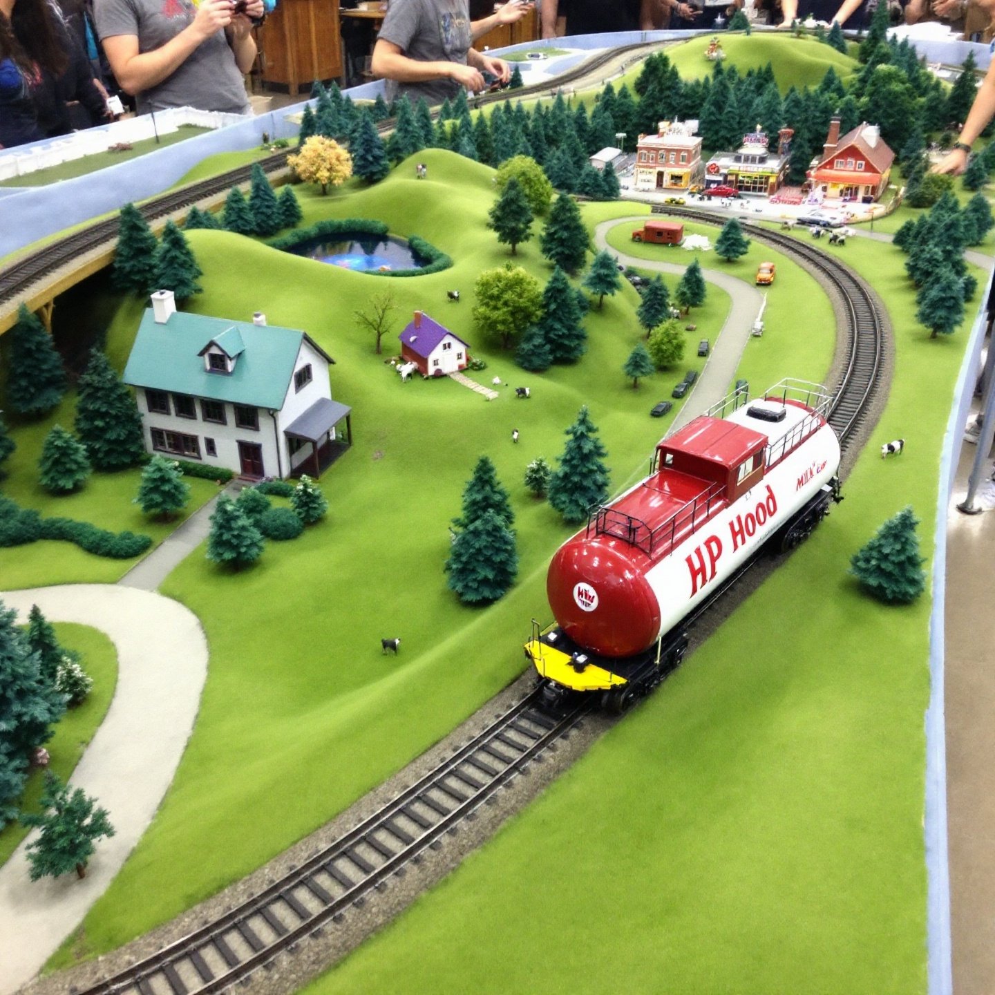 model-railroad-layout-with-hp-hood-milk-car-in-rural-to-urban-setting.jpg